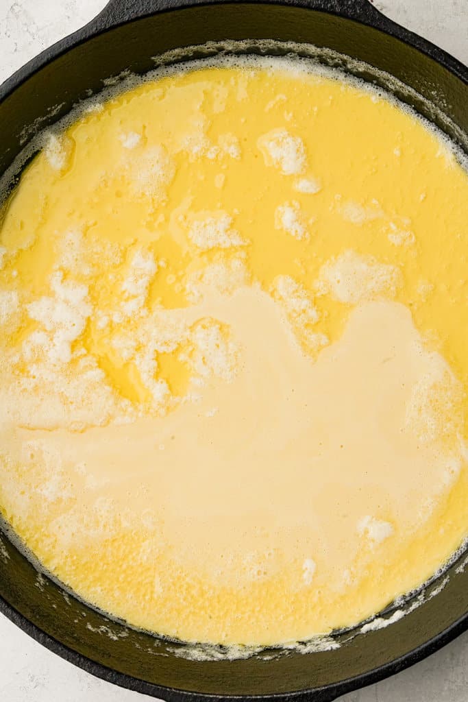 batter poured into a cast iron skillet