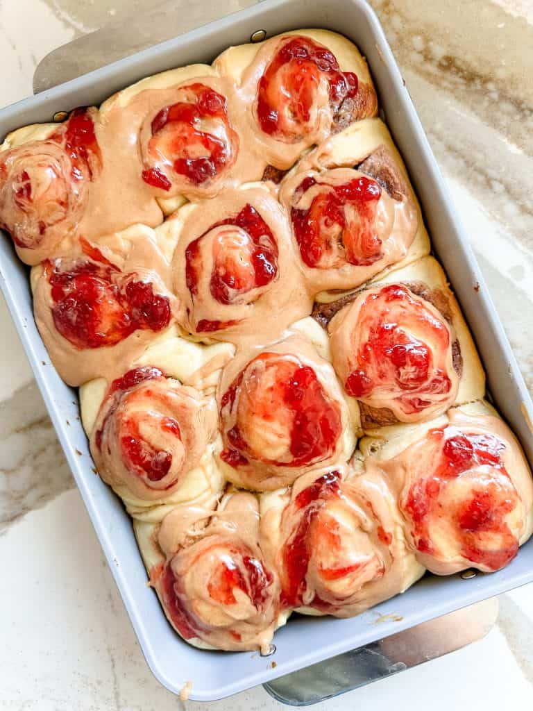 peanut butter and jelly rolls inside the baking dish  