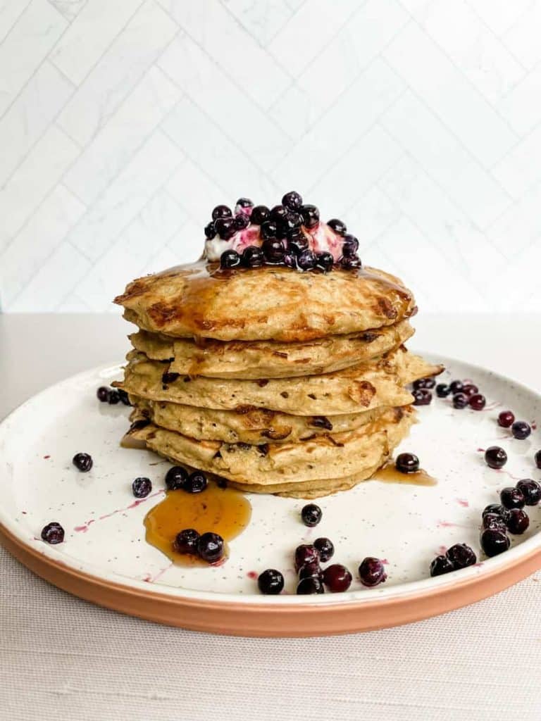 gluten free pancakes topped with blueberries