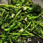 close up view of garlic broccolini in a pan