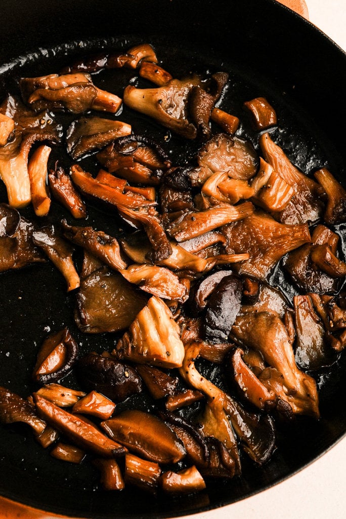 close up view of sauteed mushrooms in a pan