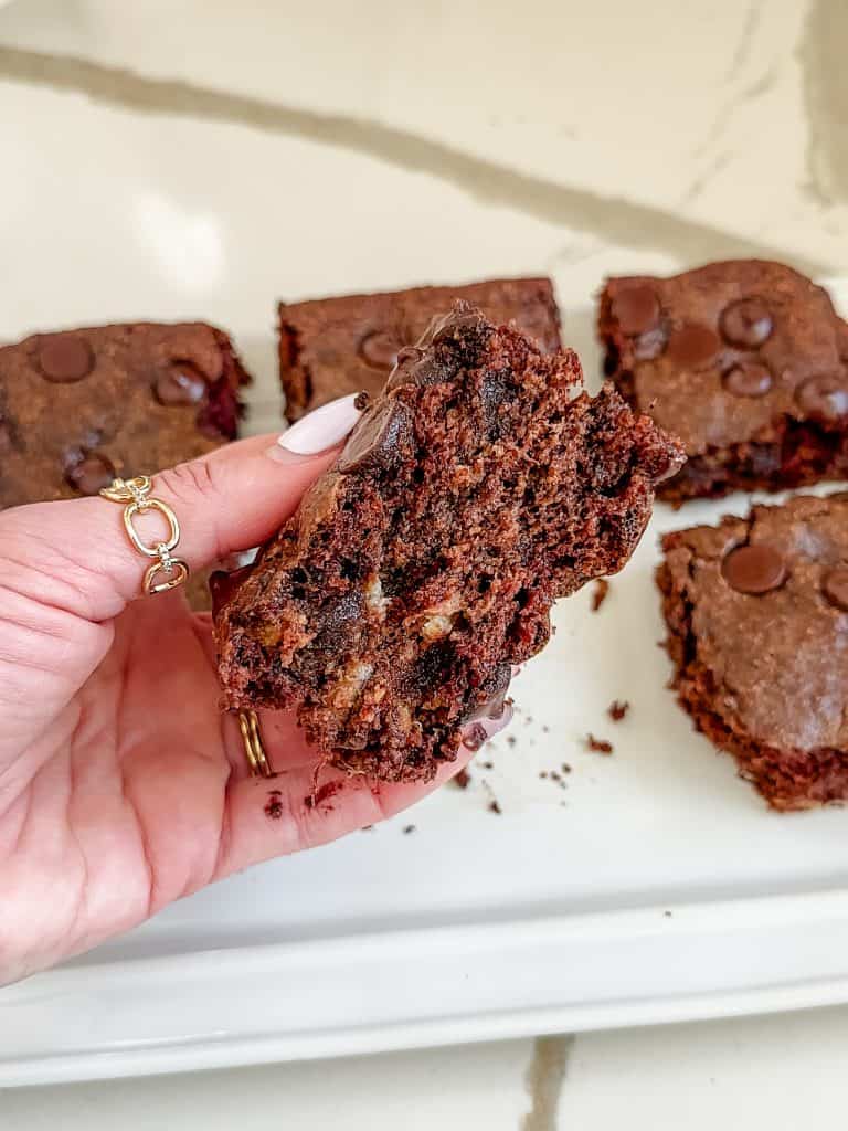 a brownie cut into half to show the inside texture. 